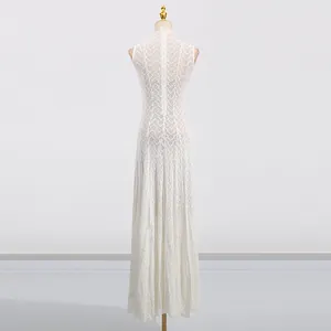 Detailed back view of an elegant French style white lace sleeveless maxi dress on mannequin