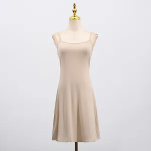 Elegant beige French sleeveless camisole dress on mannequin with slim fit front view