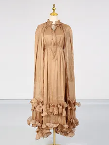 Elegant champagne long dress with ruffled hem and stylish tie neck design for women.