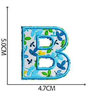 Blue floral embroidered letter B patch with iron-on backing for clothing