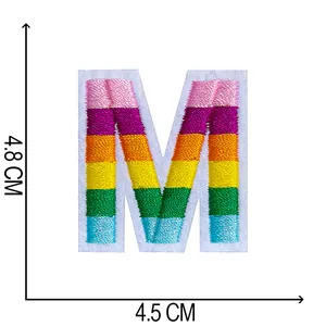 Detail view of rainbow striped letter M embroidered patch with 4.8x4.5cm dimensions