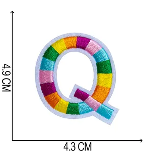 Detailed view of rainbow striped embroidered letter Q patch showing 4.9cm height