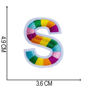 Macro detail of a 4.9cm x 3.6cm colorful rainbow embroidered letter S patch