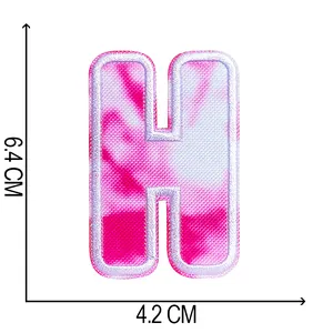 Detailed view of tie-dye embroidered letter H patch with dimensions 6.4x4.2 cm