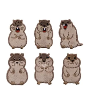 Detail view of six different cute cartoon groundhog embroidered self-adhesive patches