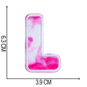 Close-up detail showing 6.3cm height and 3.9cm width of tie-dye letter L patch