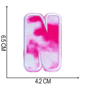 Tie-dye pink letter N embroidered patch measuring 6.5 x 4.2 cm for DIY fashion crafts