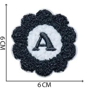 Detail view of a 6cm flower-shaped chenille embroidery patch with letter A