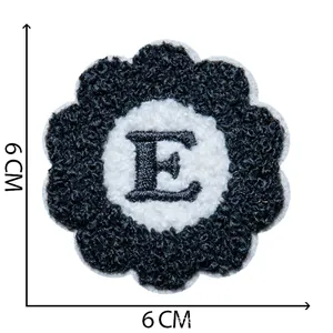 Close-up of a flower-shaped chenille embroidery patch with letter E, 6x6 cm size detail.