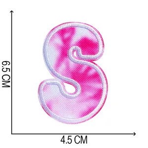 Detailed close-up of a pink tie-dye embroidered letter S patch with dimensions in cm