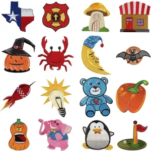 Variety of colorful embroidered iron-on patches for DIY clothing decoration projects