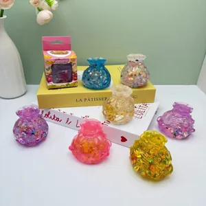 Colección de juguetes antiestrés con forma de bolsa de dinero y lentejuelas brillantes.