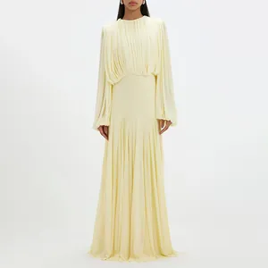 Elegant long-sleeved pale yellow pleated dress with a sophisticated round neck design.
