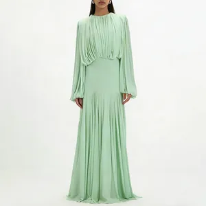 Full length view of an elegant mint green pleated maxi dress with lantern sleeves