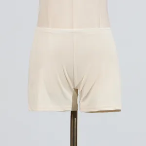 Comfortable cream-colored elastic safety shorts for women shown on a mannequin display