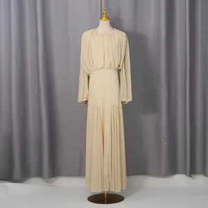 Elegant French style long dress with pleated details and cinched waist on mannequin.