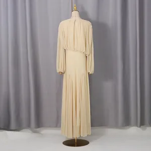 Elegant pleated maxi dress with balloon sleeves and a cinched waist, shown from the back view
