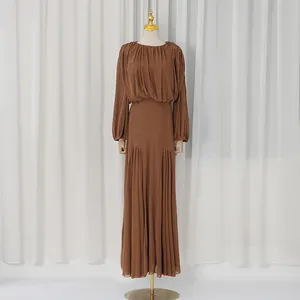 Elegant brown long-sleeved maxi dress with pleated details and cinched waist