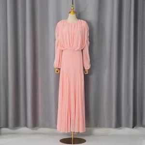 Elegant pink French style long dress with pleated details and round neck.