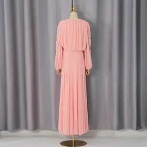 Back view of elegant pink French style long dress with pleated details and long sleeves