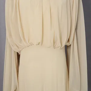 Detail of French-style beige pleated long dress with soft mesh fabric
