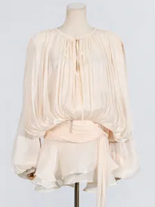 Elegant beige pleated mini dress featuring lantern sleeves and ruffle hem for summer wear.
