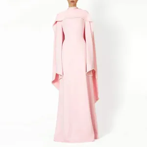 Elegant pink long-sleeve gown featuring a unique cape design with delicate pearl trimming
