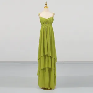 Elegant green tiered maxi dress with spaghetti straps and irregular hem design.