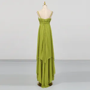 Back view detail of green spaghetti strap maxi dress with irregular layered hem.