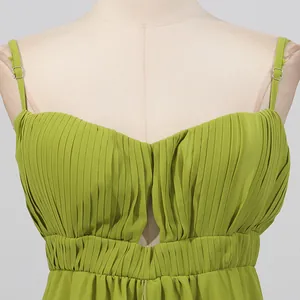 Close-up of green pleated maxi dress featuring a sweetheart neckline and straps.