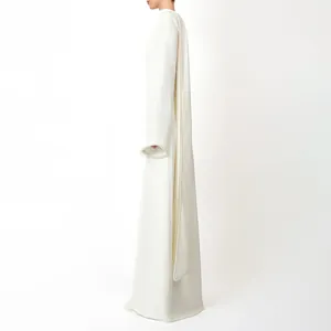 Elegant white long-sleeve evening dress featuring a cape design with pearl-beaded edges