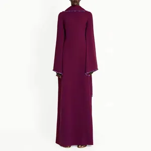 Elegant plum-colored long-sleeved evening gown featuring a hooded cape and beaded cuff details.