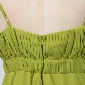 Close-up detail of back zipper and pleats on a lime green vacation maxi dress