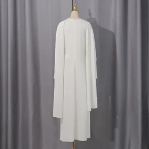 Back view detail showing the elegant white long dress with pearl beaded cape design