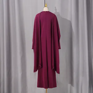 Elegant dark purple long evening gown featuring a stylish cape design and back zipper