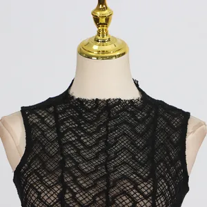 Detailed view of the retro black lace neckline featuring elegant scalloped edges.