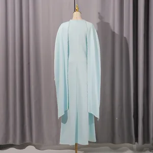 Back view of this light blue French style maxi dress featuring a pearl-trimmed cape