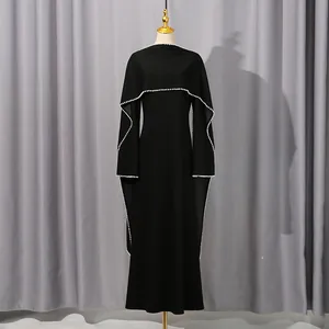 Detailed visual of a French black maxi dress with elegant shawl design and pearl bead trim