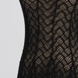 Detail view of the intricate black chevron lace pattern on a vintage slim-fit maxi dress.