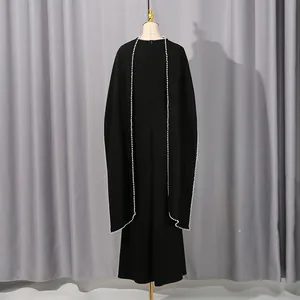 Elegant black French style maxi dress with cape and pearl trim detail.