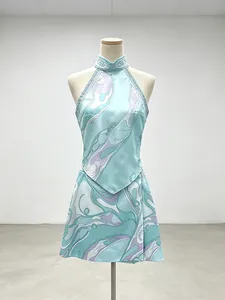 Vacation style sleeveless halter neck top and matching printed mini skirt set in blue
