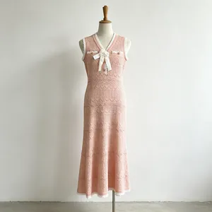 Pink sleeveless knitted mermaid dress with V-neck lace trim and bow flower detail