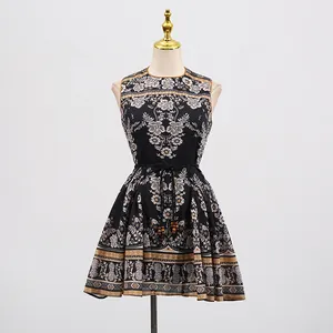 Close-up of vintage floral print and beaded waist tie on a sleeveless mini dress.