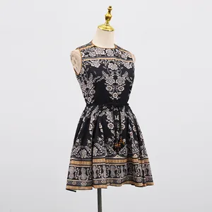 Detail view of a French vintage sleeveless dress featuring intricate floral and pineapple prints.
