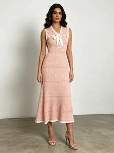 Elegant pink sleeveless knit fishtail midi dress with decorative white bow and lace trim