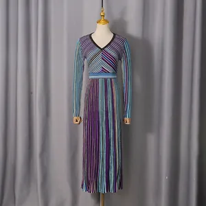 Elegant colorful striped knitted maxi dress with V-neck on a professional mannequin
