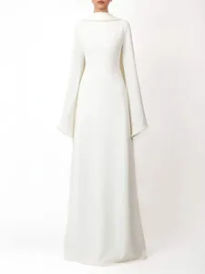 Elegant French style white maxi dress featuring floor-length cape sleeves and pearl neckline