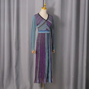 Elegant V-neck knit long dress with colorful stripes and high-waist design on mannequin.