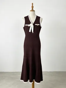 Elegant sleeveless knitted mermaid dress with V-neck lace trim and decorative white bow