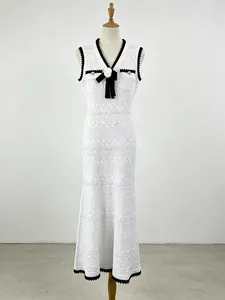 Elegant white sleeveless knitted fishtail maxi dress with 3D flower decoration and black trim